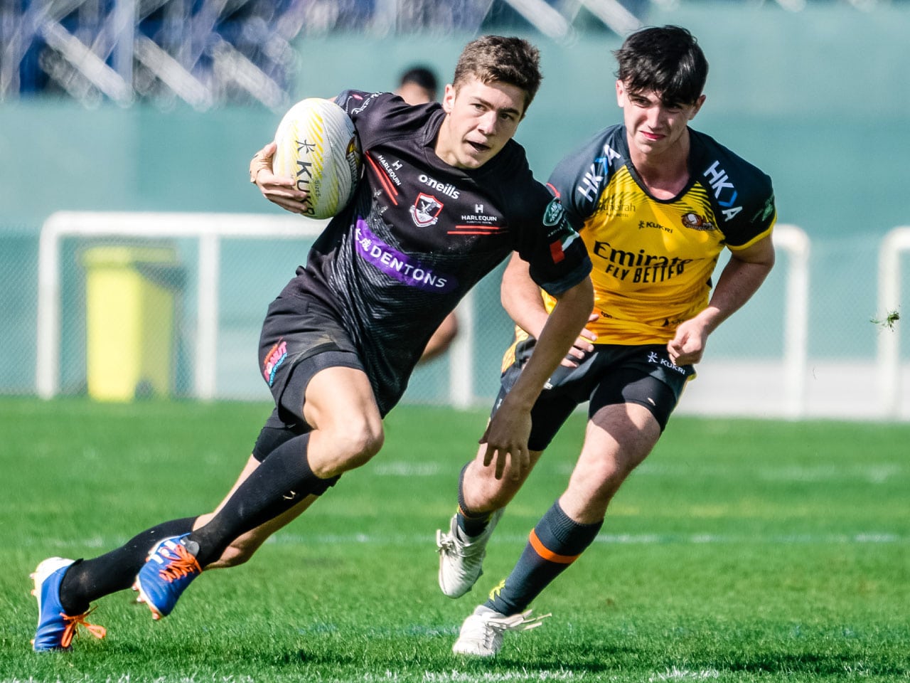 Dubai Exiles Under 19 youth rugby player off to score a try